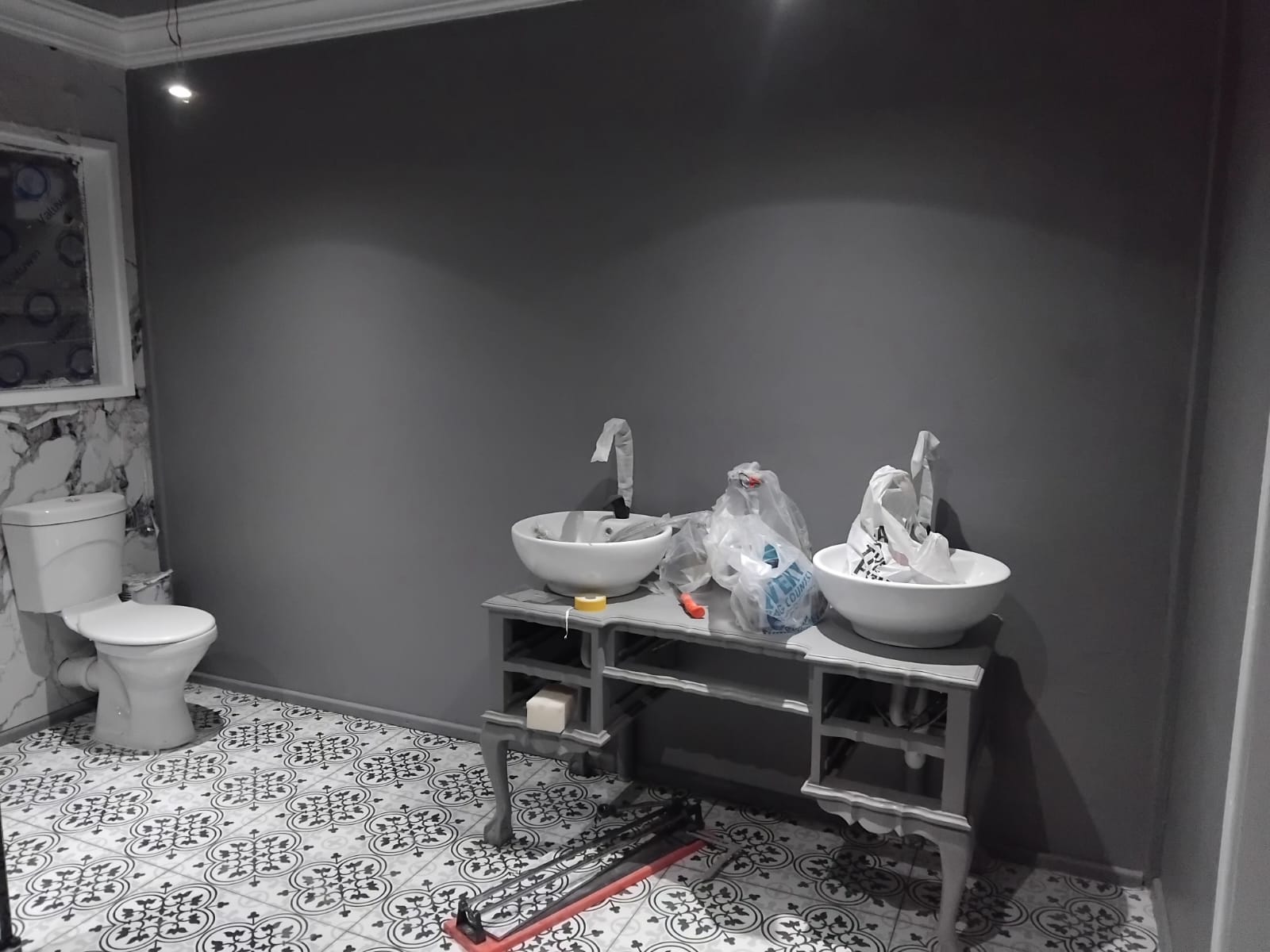 Bathroom with custom vanity and patterned floor